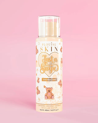 Bottle of the P.Louise Just A Swipe Micellar Water in coconut cake against a pink background