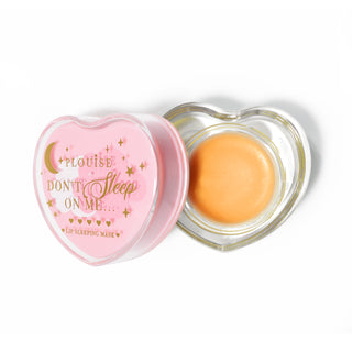 Pink heart-shaped lip sleeping mask with the lid off on a white background