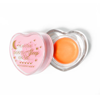 Pink heart-shaped lip sleeping mask with the lid off on a white background