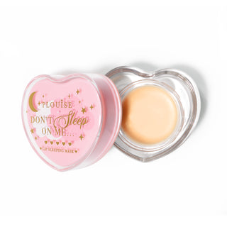 Pink heart-shaped lip sleeping mask with the lid off on a white background