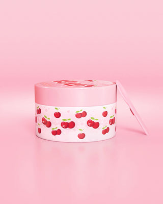 Pink container with cherry design on a pink background