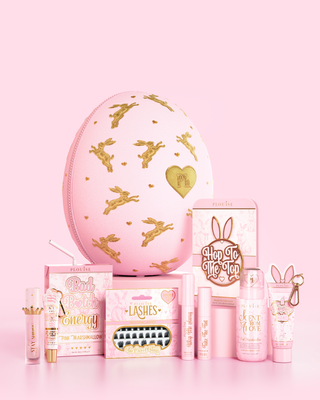 Pink P.Louise Easter Egg with a selection of pink marshmallow scented makeup, skincare and bodycare products against a pink background