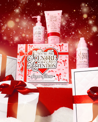 P.Louise Youre The SCentre of Attention bodycare Cosmetic set with pink festive packaging on a red background with snowflakes.