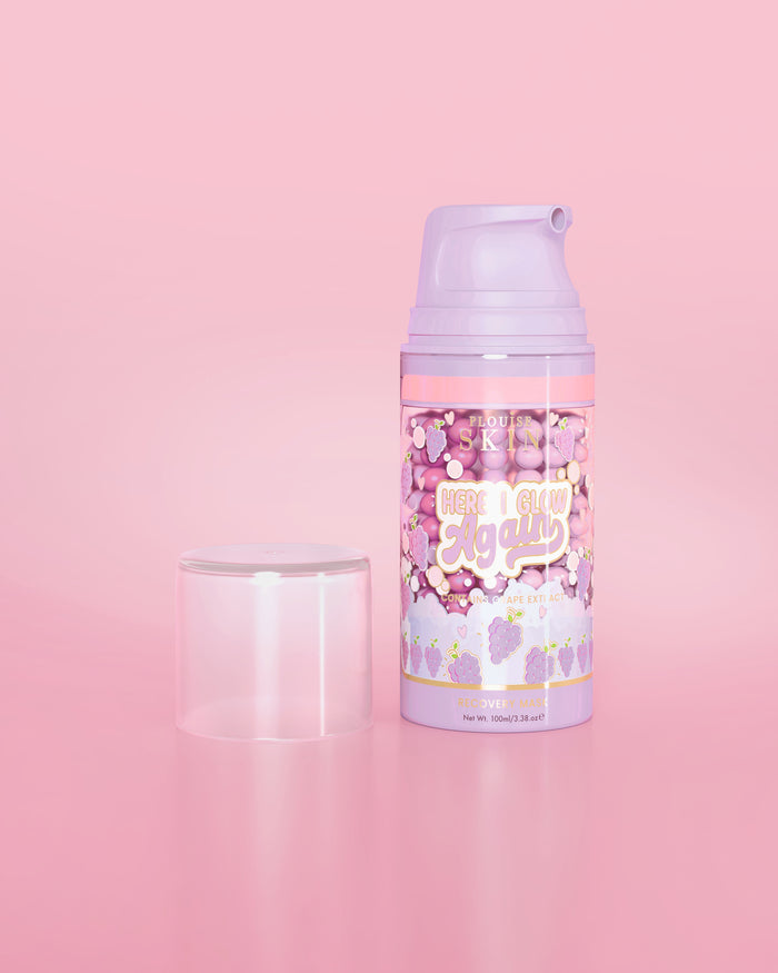 Purple bottle of P. Louise Here I Glow Again Grape Recovery Mask on a pink background