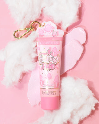 Tube of P. Louise A Helping Hand Hand Cream with candy floss on a pink background