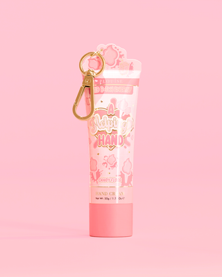 Tube of P. Louise A Helping Hand Hand Cream with a candy floss design on a pink background