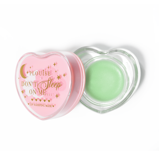 Pink heart-shaped lip sleeping mask with the lid off on a white background