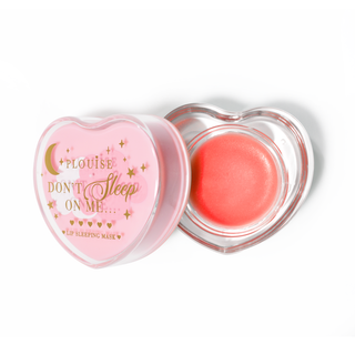 Pink heart-shaped lip sleeping mask with the lid off on a white background