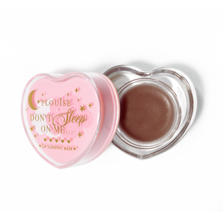Pink heart-shaped lip sleeping mask with the lid off on a white background